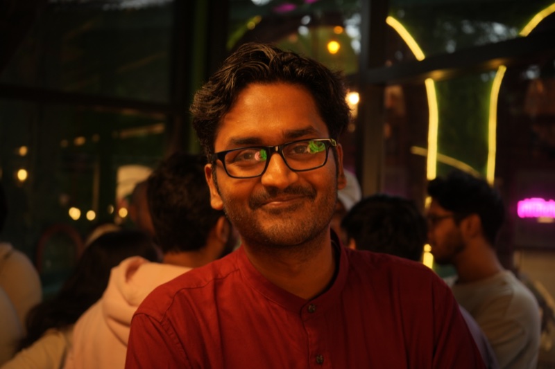 Chandra smiling at a social event